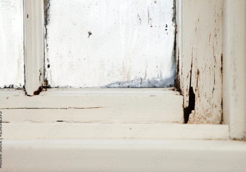 Rotting wood window frame needing vinyl replacement windows